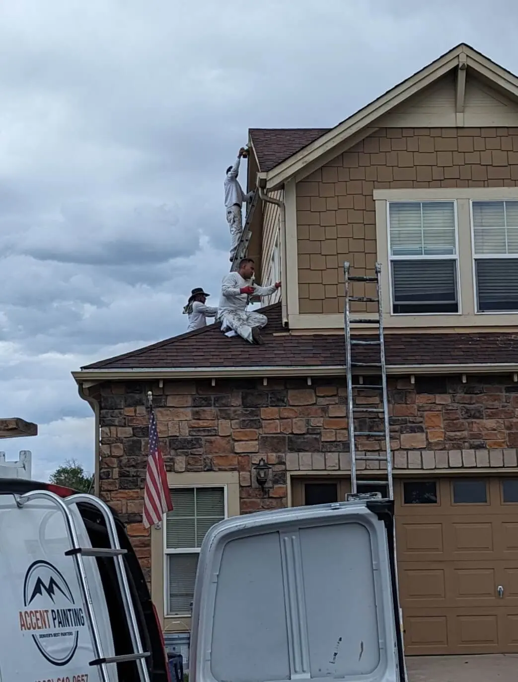Professional painters from Accent Painting using ladders for exterior residential painting and home improvement services in Arvada, CO.