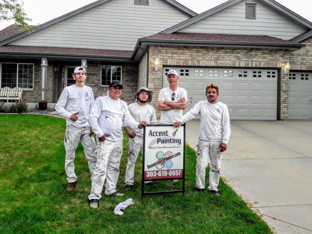 Five members of Accent Painting crew standing outside of completed home paint job