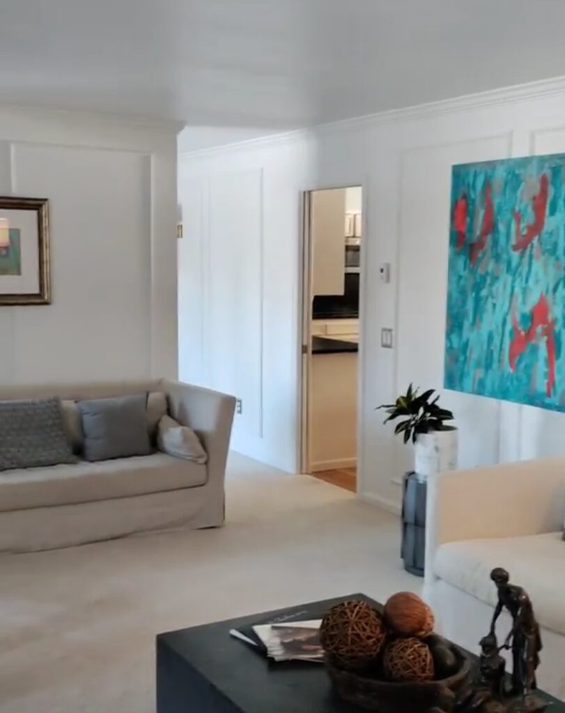 Home living room with abstract painting on wall
