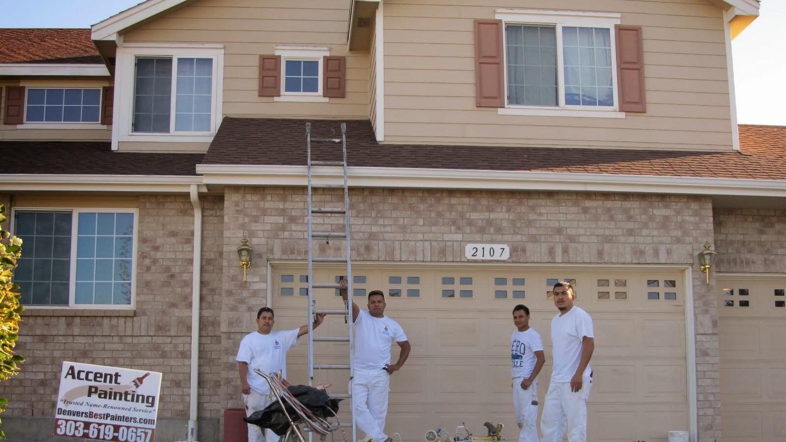 IMG-41312084808573ba73d4c2059edd8f8c-V Four crew members standing outside of newly painted home in Centennial, CO
