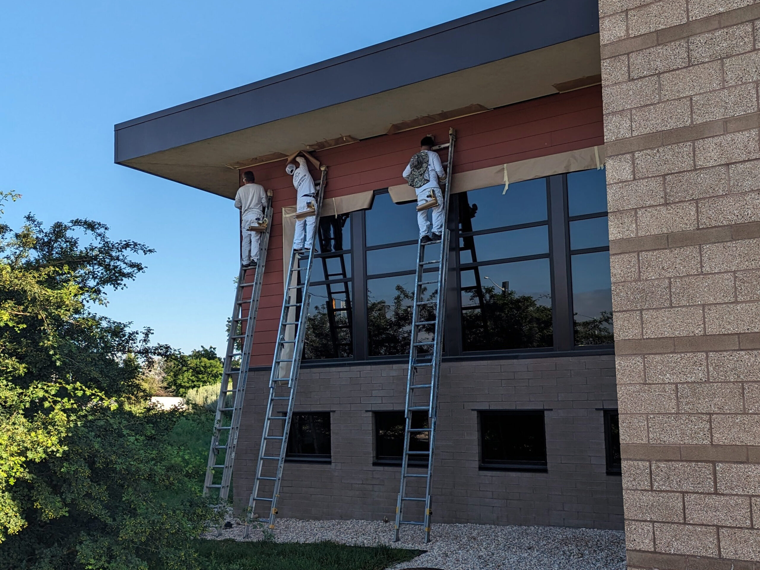 Exterior of the Anythink Library in Adams County Colorado being painted by Accent Painting company crew