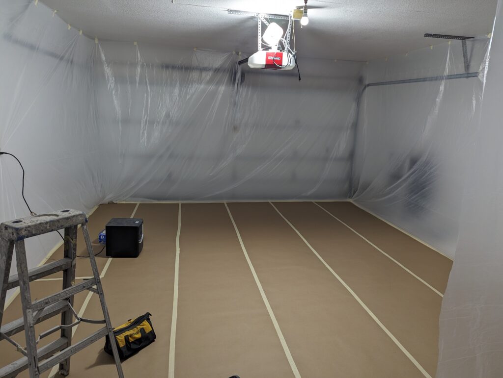 Commercial paint preparation work with plastic sheeting and floor protection